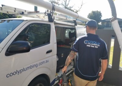 Mike from the Cooly Plumbing team getting plumbing tools from his van