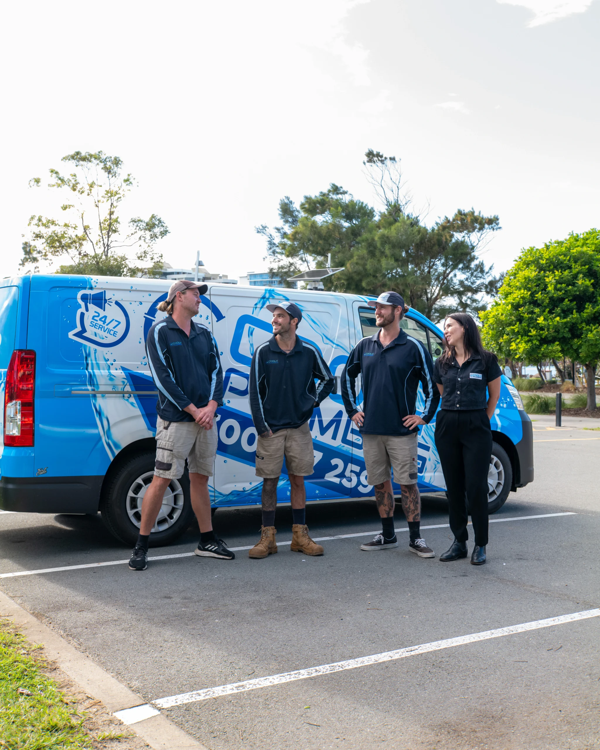 Team about to install a heat pump hot water system